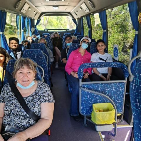 a group of people sitting on a bus