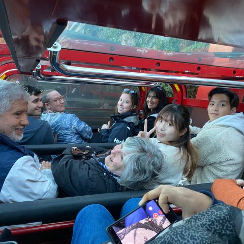 a group of people sitting on a bench