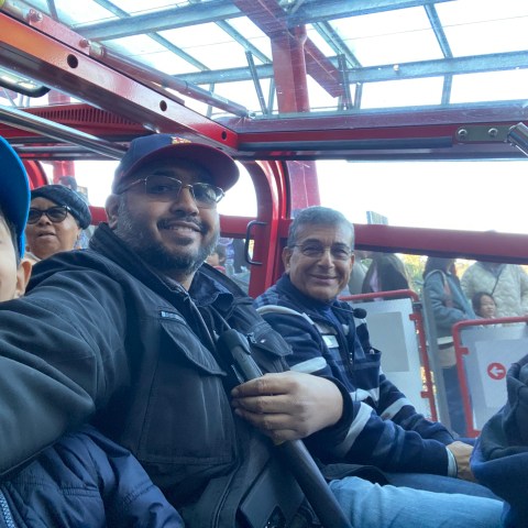 a group of people sitting on a bus