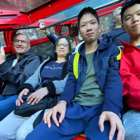 a group of people sitting posing for the camera