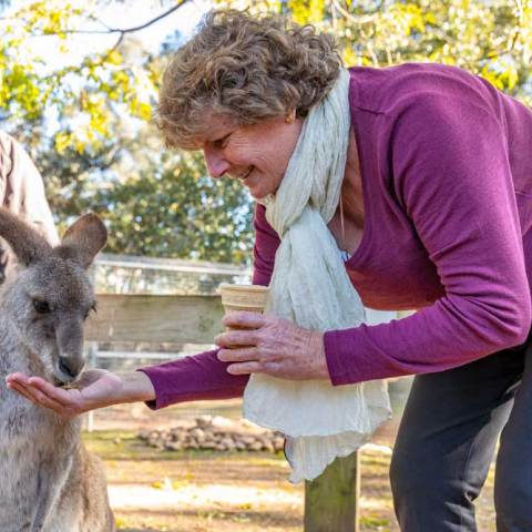 a man and a woman holding an animal