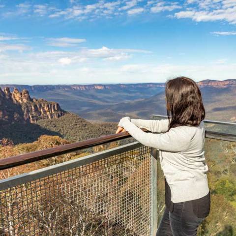 a man standing in front of a mountain