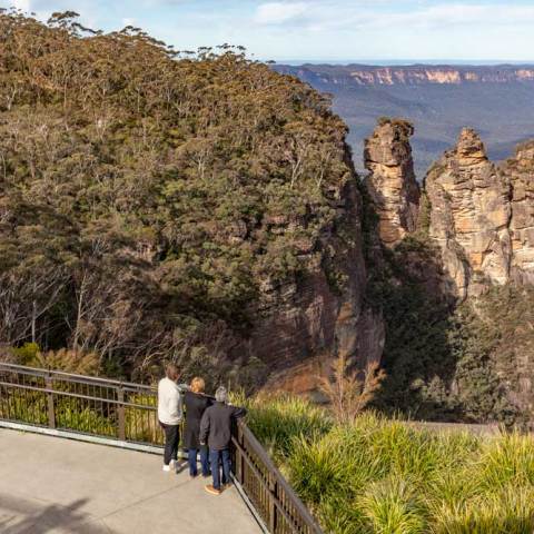 a group of people standing on top of a mountain