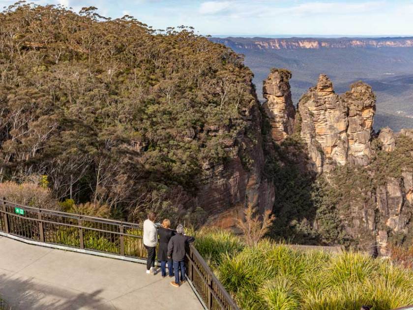 a group of people standing on top of a mountain