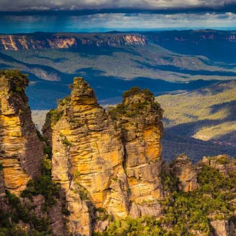 a canyon with a mountain in the background