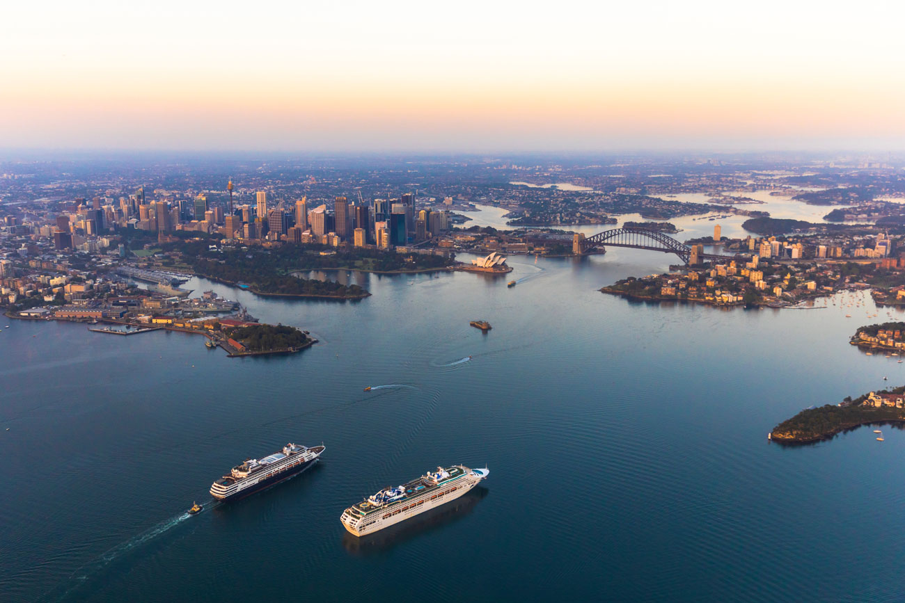 a large body of water with a city in the background