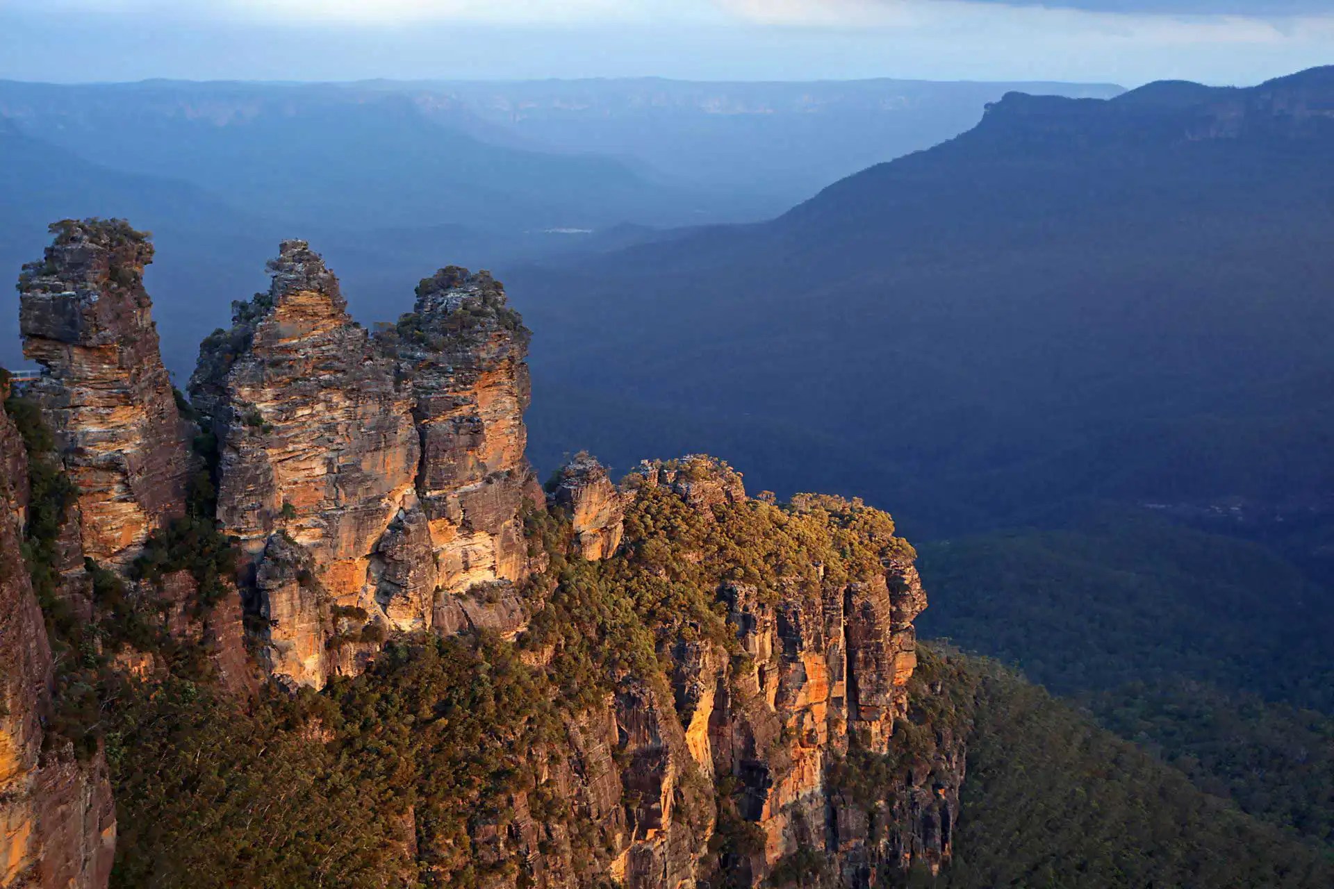 a canyon with Three Sisters in the background