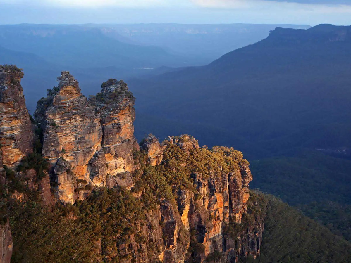 a canyon with Three Sisters in the background